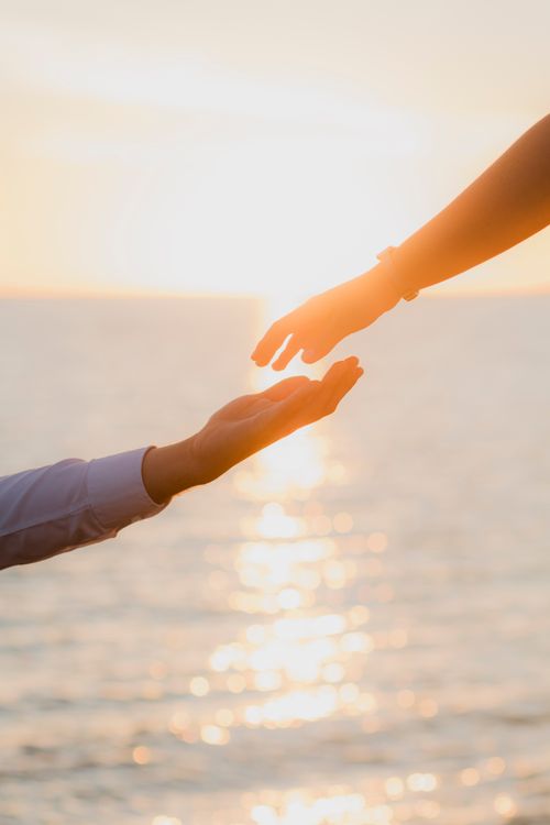 Free Captivating image of hands reaching out against a sunset in Sinaloa, evoking love and connection. Stock Photo