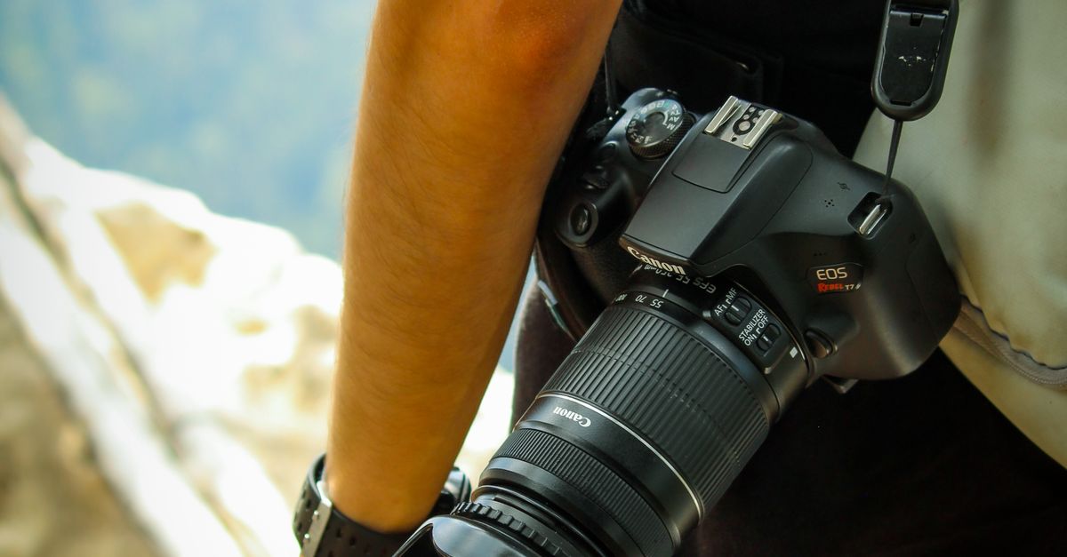 Photographers Exploring Photographer Exploring Outdoors with Camera · Free Stock Photo