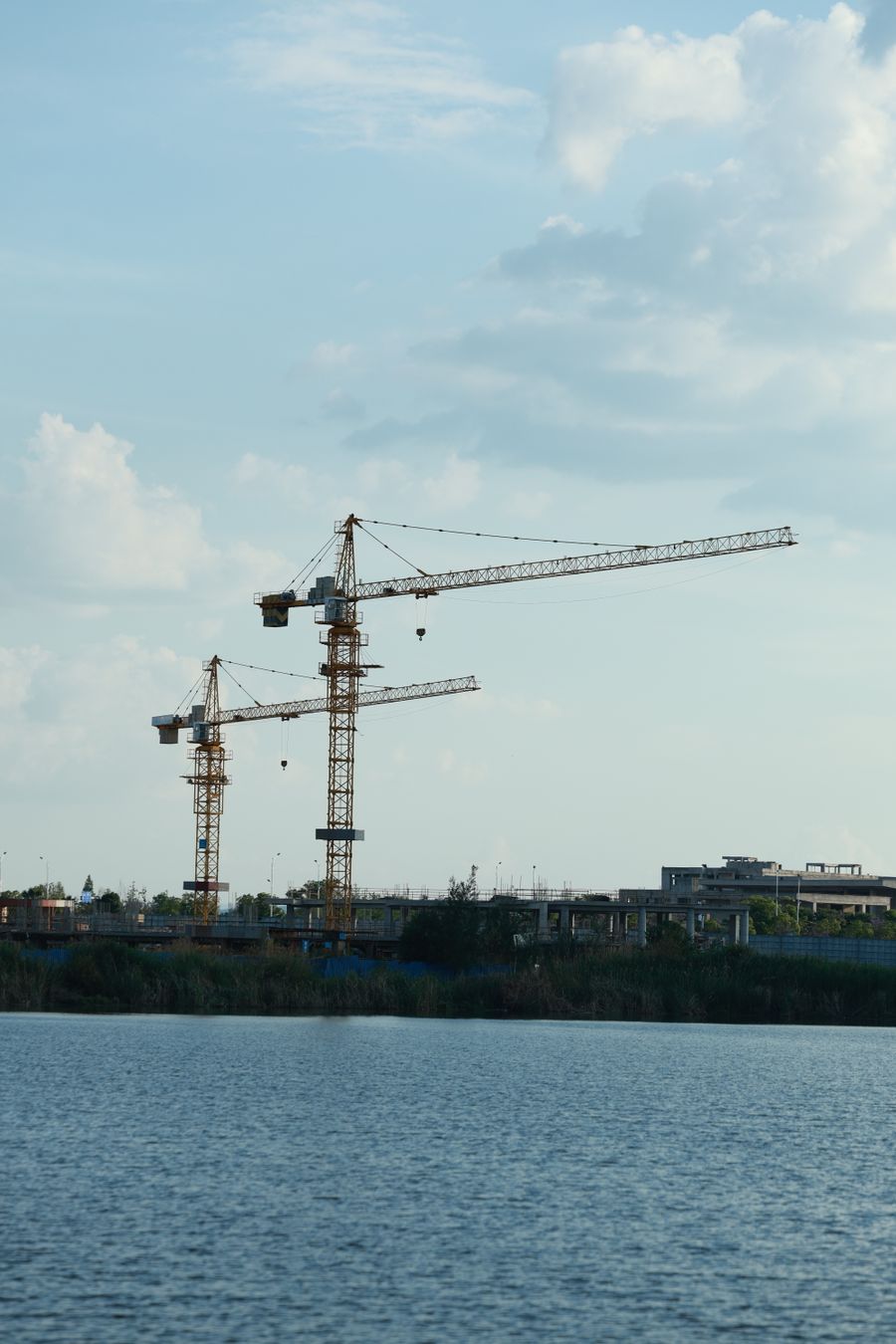 Crane lifting heavy project cargo at a construction site