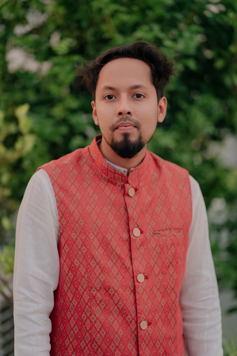 Man in Traditional Red Vest in Outdoor Setting · Free Stock Photo