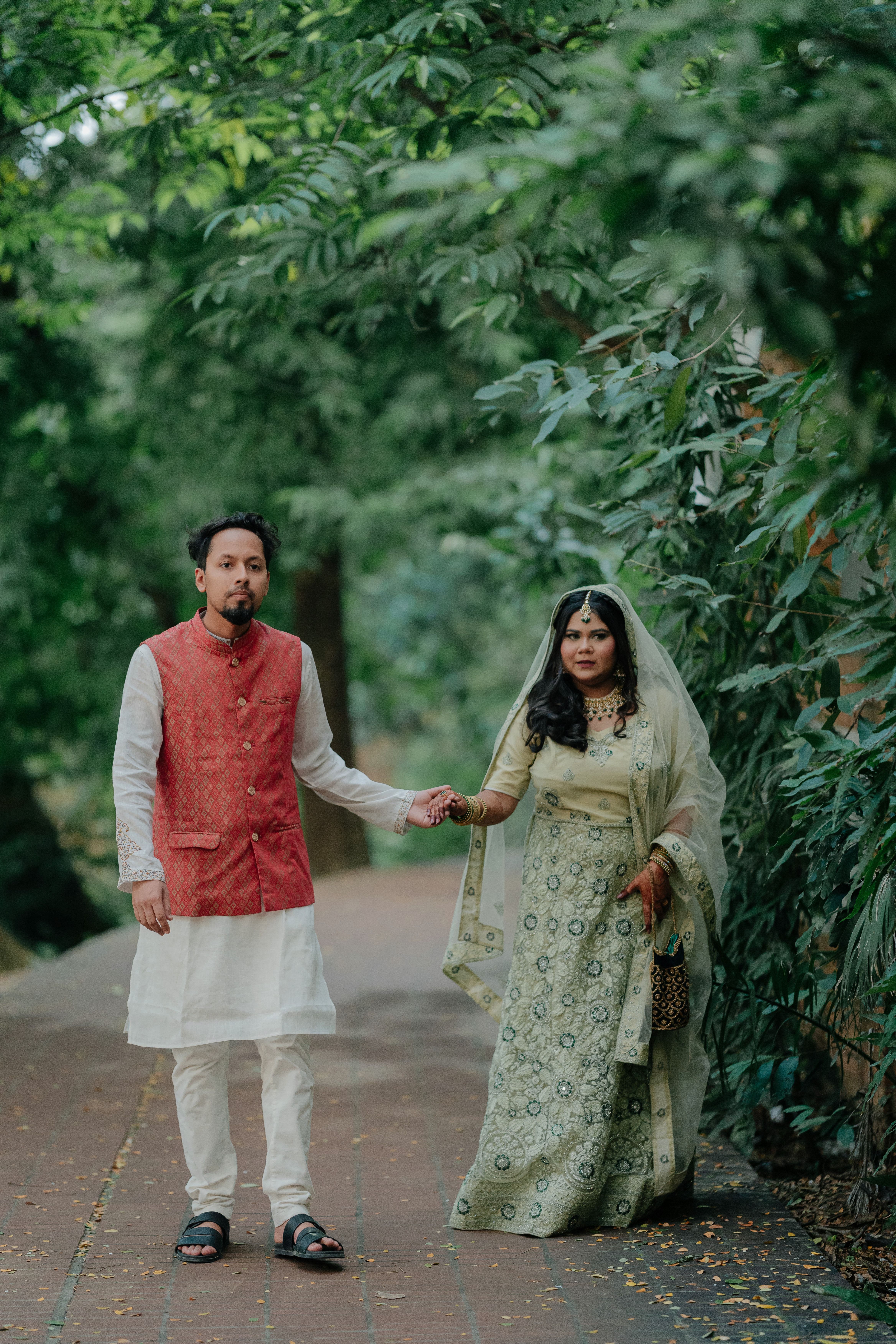 Elegant Couple in Traditional Attire Outdoors · Free Stock Photo