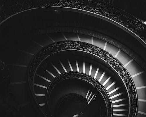 Grayscale Photography of Spiral Stairs