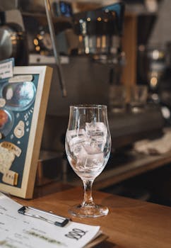 A stylish coffee shop in Shinjuku, Japan featuring a glass of ice on the counter.