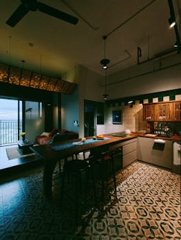 Stylish kitchen interior with warm lighting and vintage decor in Ho Chi Minh City apartment.