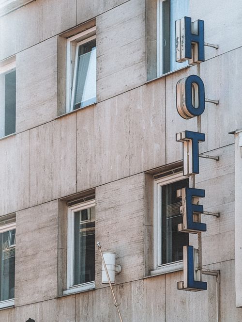Free Modern hotel facade in Marburg, Germany featuring vertical signage with stylish architecture. Stock Photo