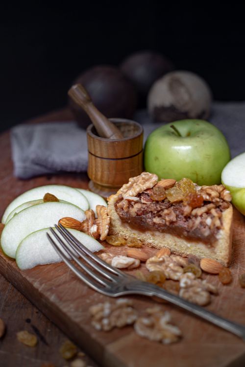 Free Delicious rustic apple walnut tart with fresh apples and nuts on a wooden board, perfect for dessert lovers. Stock Photo