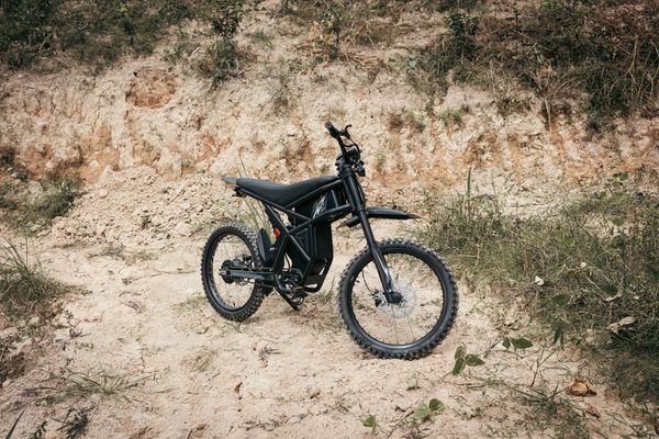 Fresh electric dirt bike build on a dirt slope
