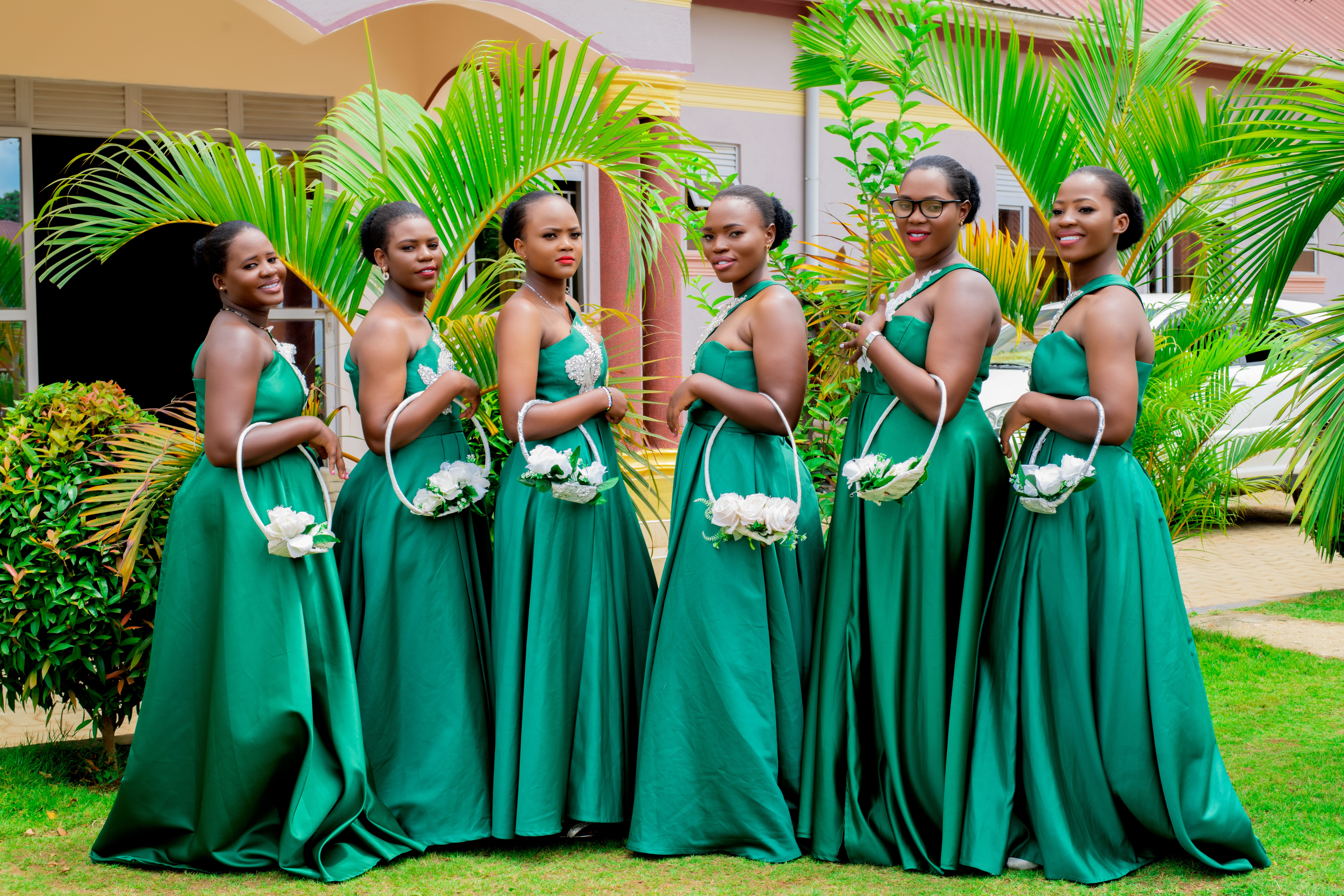 Elegant Group of Bridesmaids in Green Dresses  Free Stock Photo