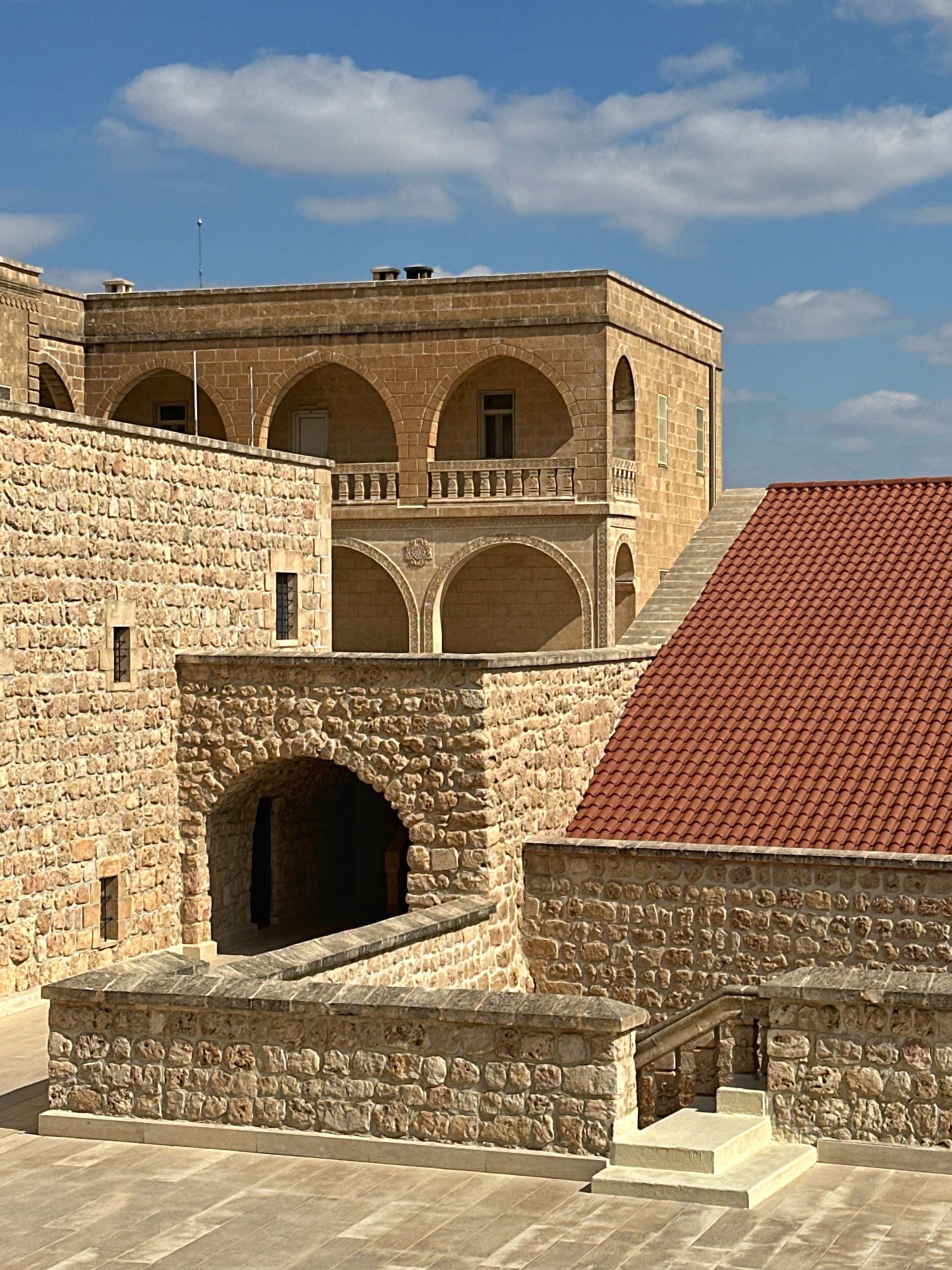 Historic Stone Architecture with Arched Balconies · Free Stock Photo