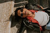 Stylish Man in Leather Jacket Sunbathing Outdoors