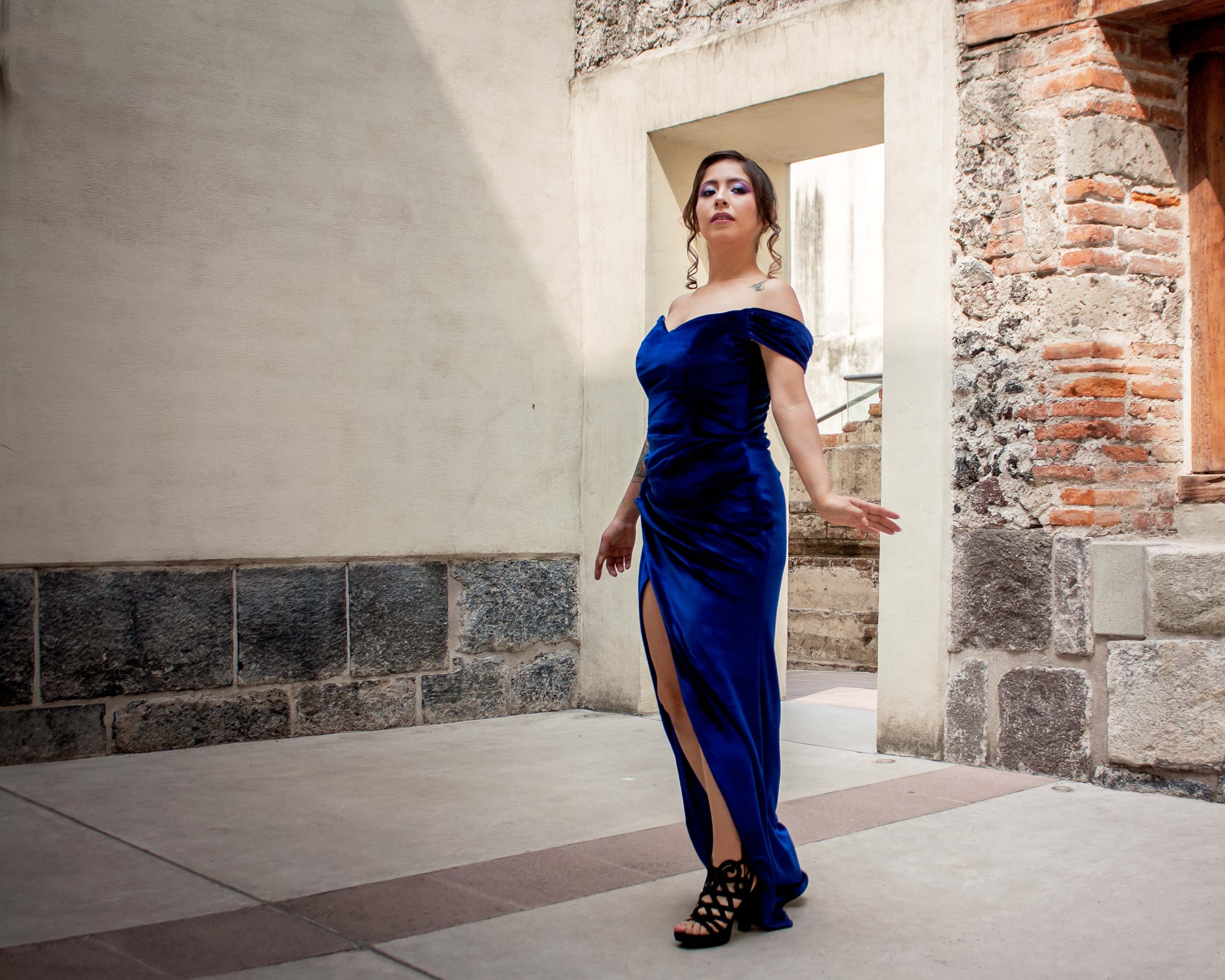 Elegant Latina Woman in Blue Dress on Balcony  Free Stock Photo