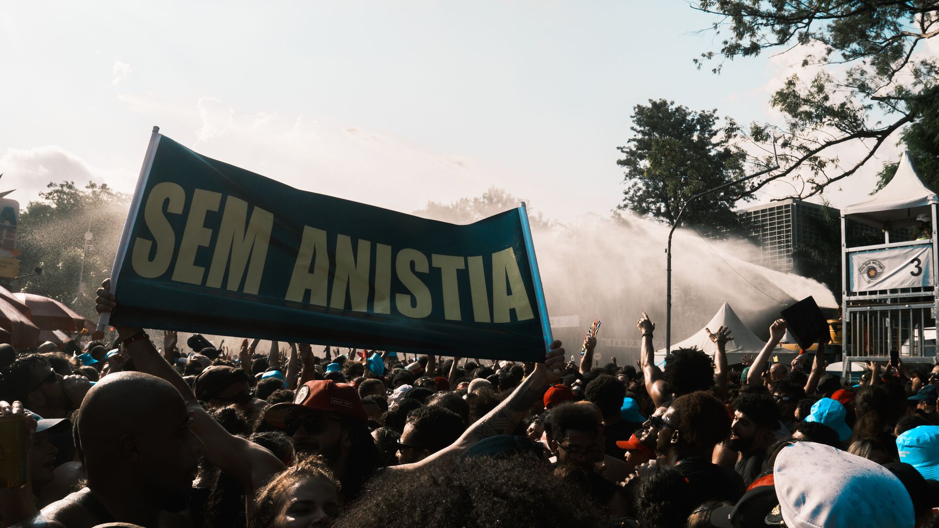Event Banners: Elevate Your Brand with Powerful Visuals 3 Large crowd demonstrating with a 'Sem Anistia' banner, conveying a powerful protest message — event banners