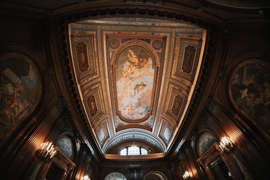 Detailed view of the ornate ceiling in the New York Public Library's interior.