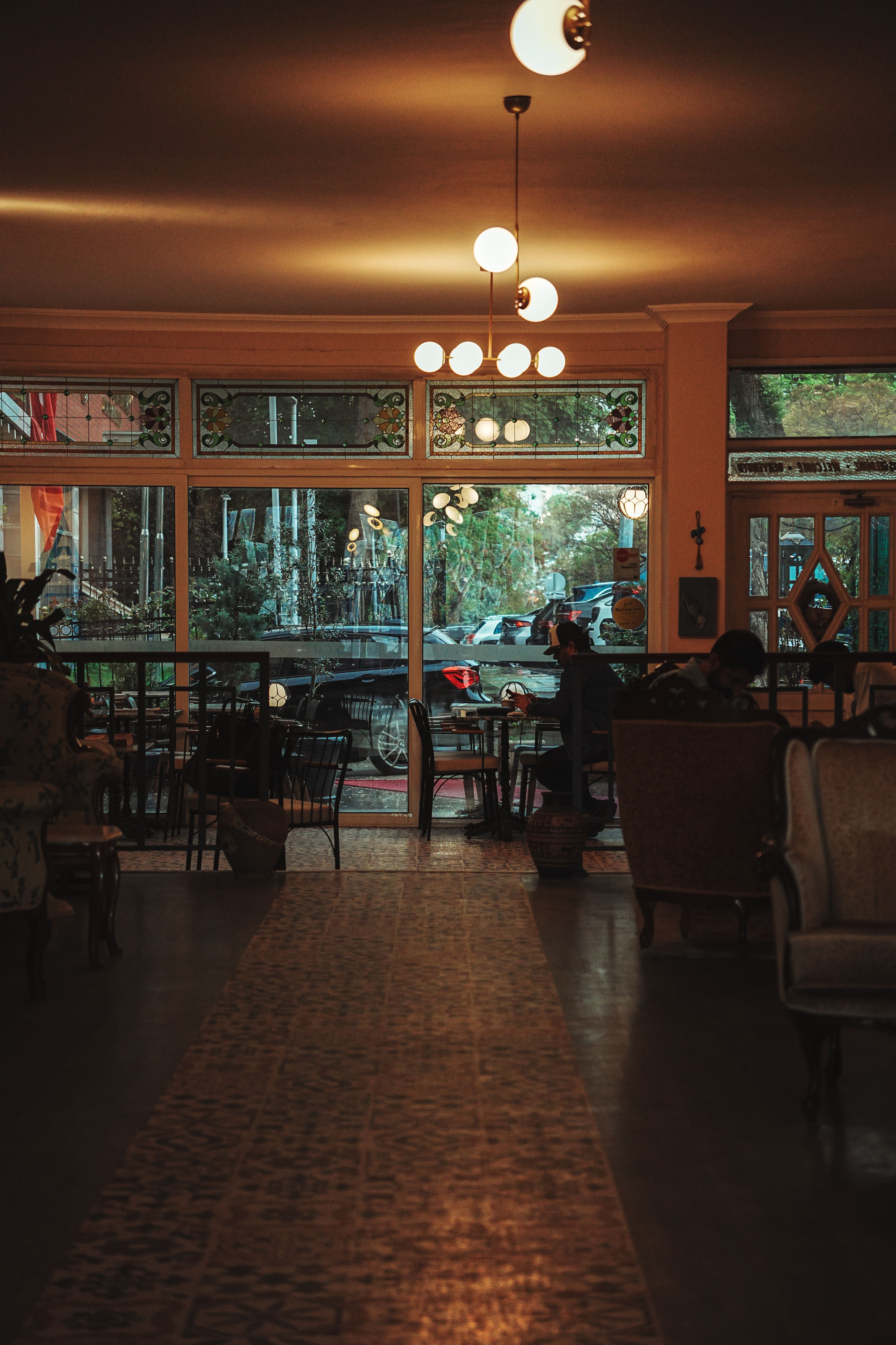 Cozy Vintage Cafe Interior with Warm Lighting · Free Stock Photo