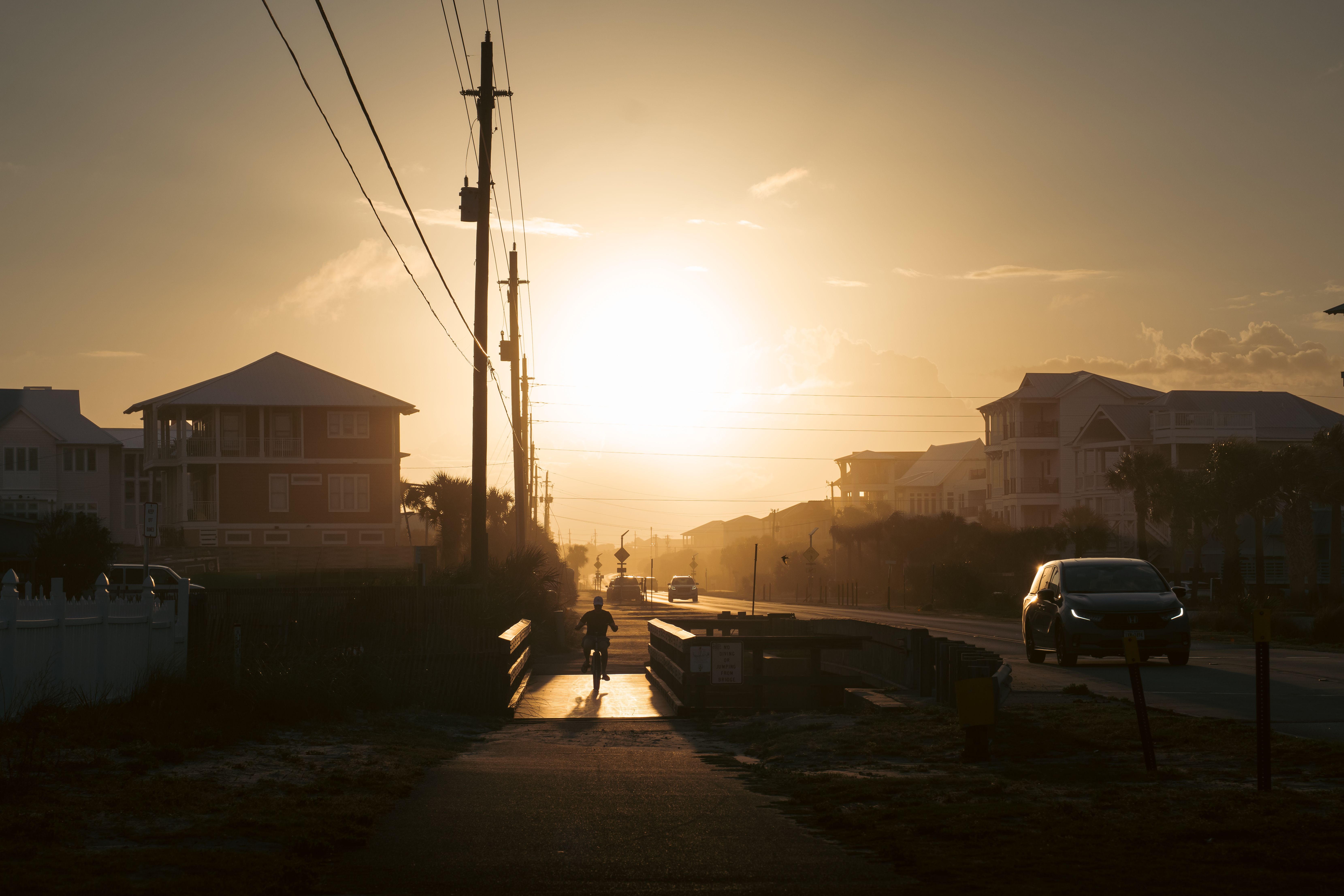 Sunset drive along a Florida Gulf Coast road near Scenic Highway 30A and Destin vacation rental investment properties