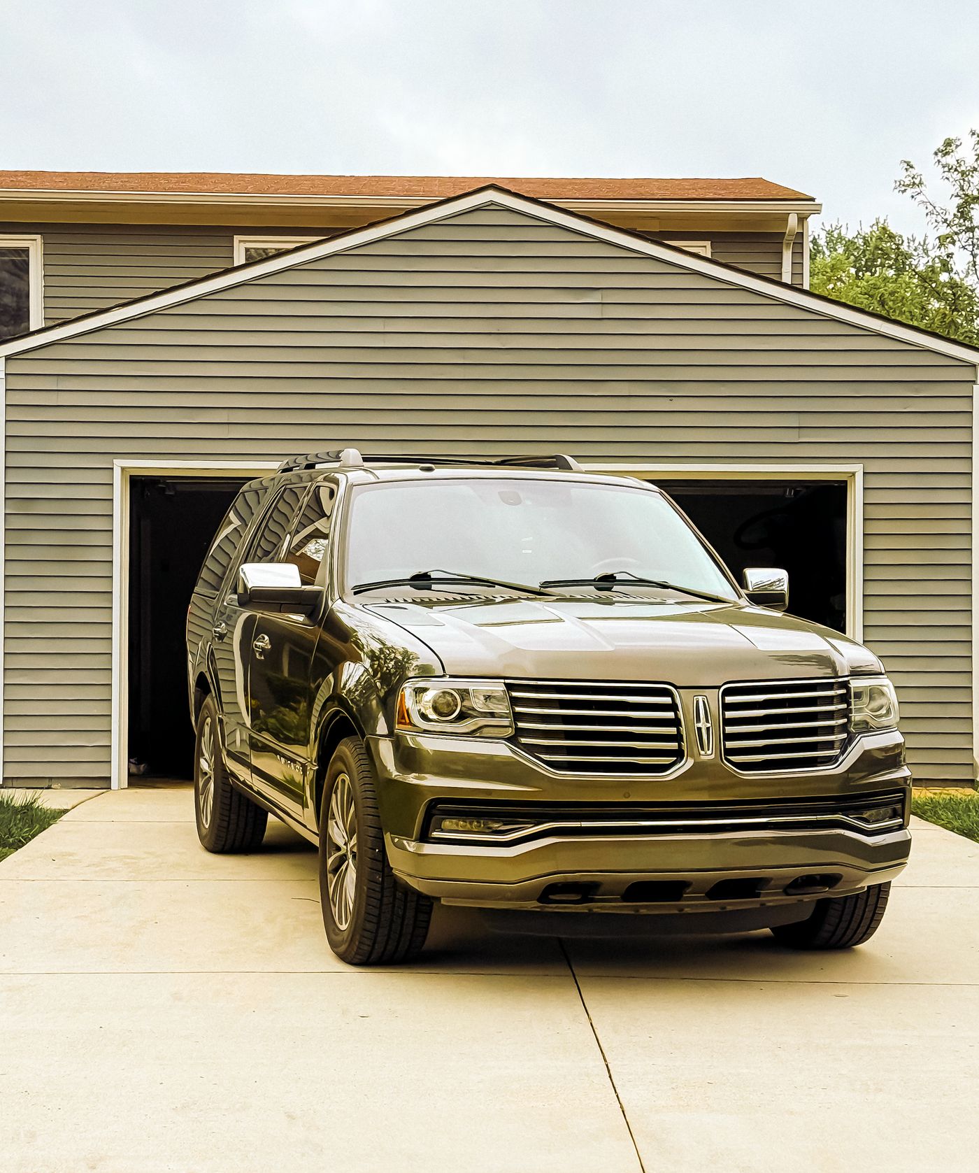 A family Tahoe in a Johns Island driveway on a calm Lowcountry morning.