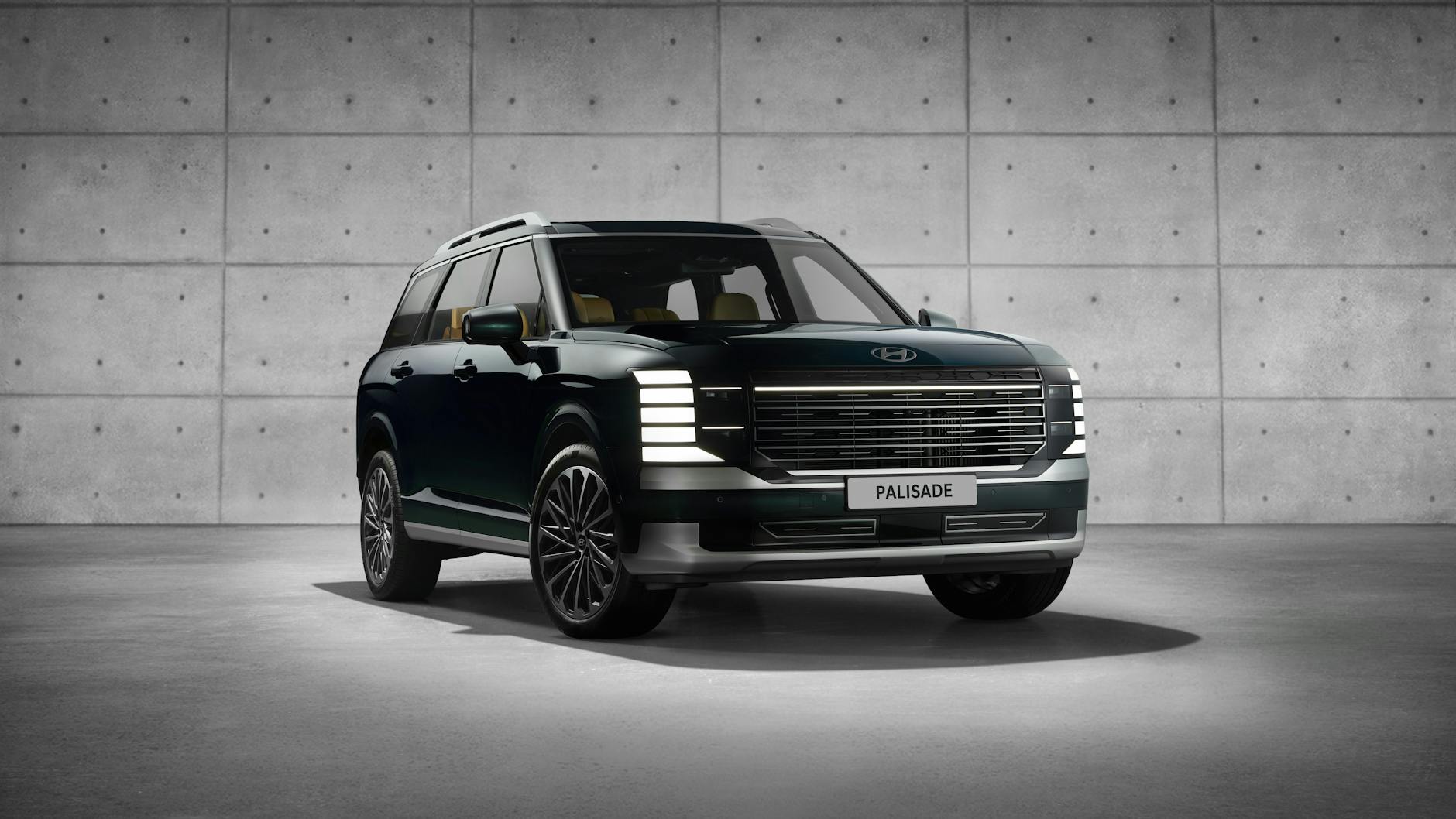 Sleek Hyundai Palisade SUV showcased in a modern indoor studio setting.