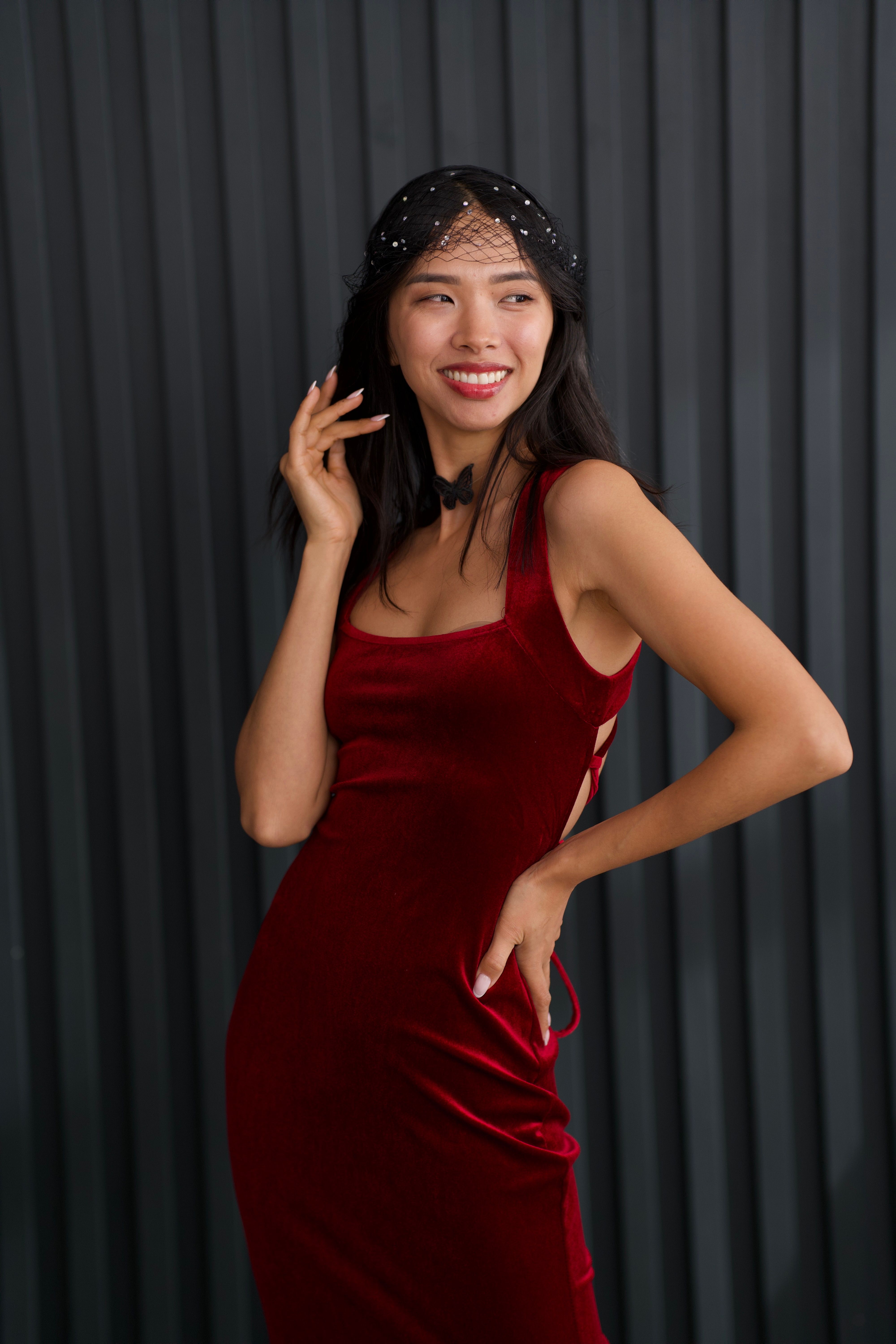 Elegant Woman in Red Dress with a Stylish Fascinator  Free Stock Photo