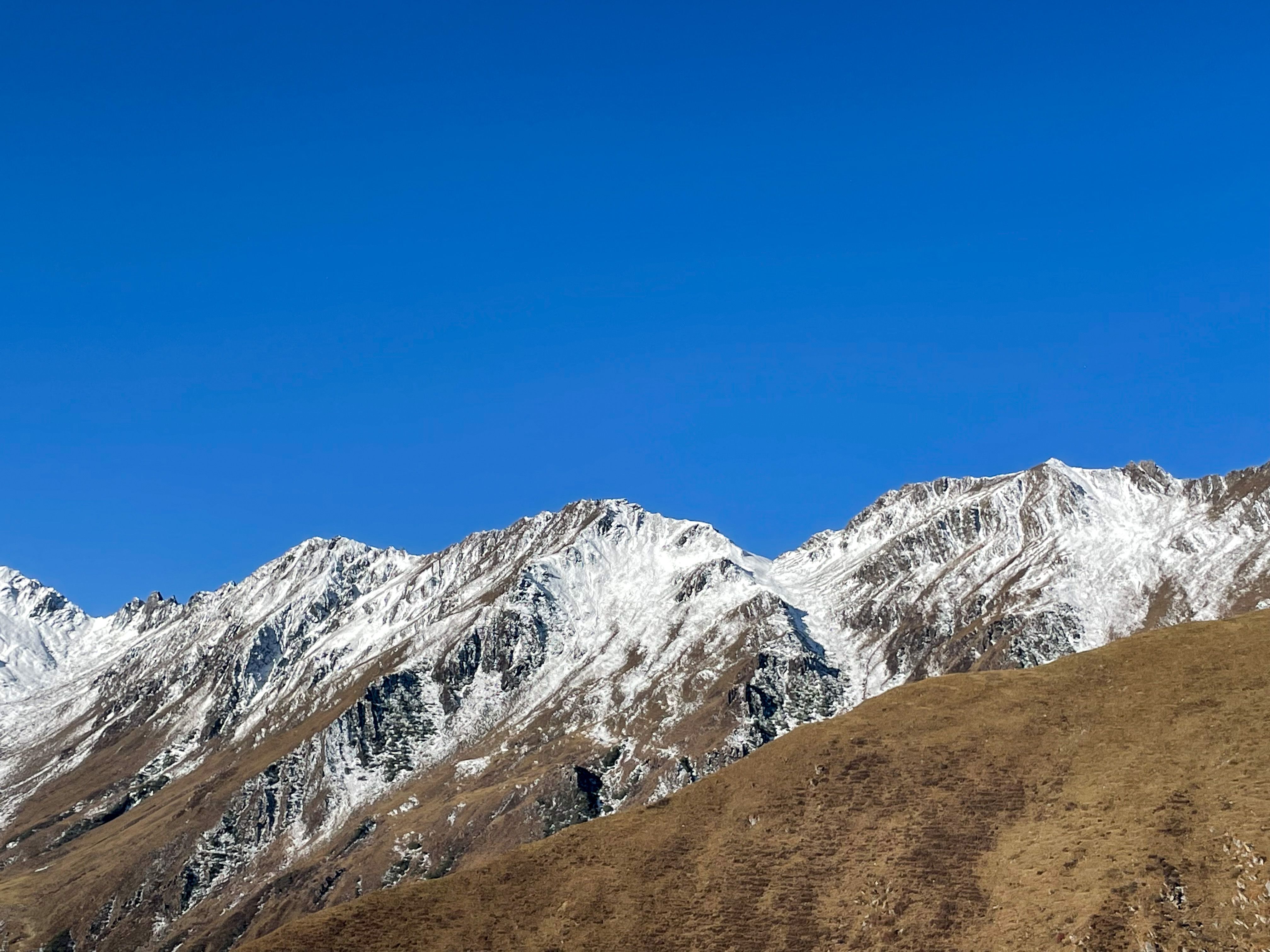 Snow-Capped Mountains under Clear Blue Sky · Free Stock Photo