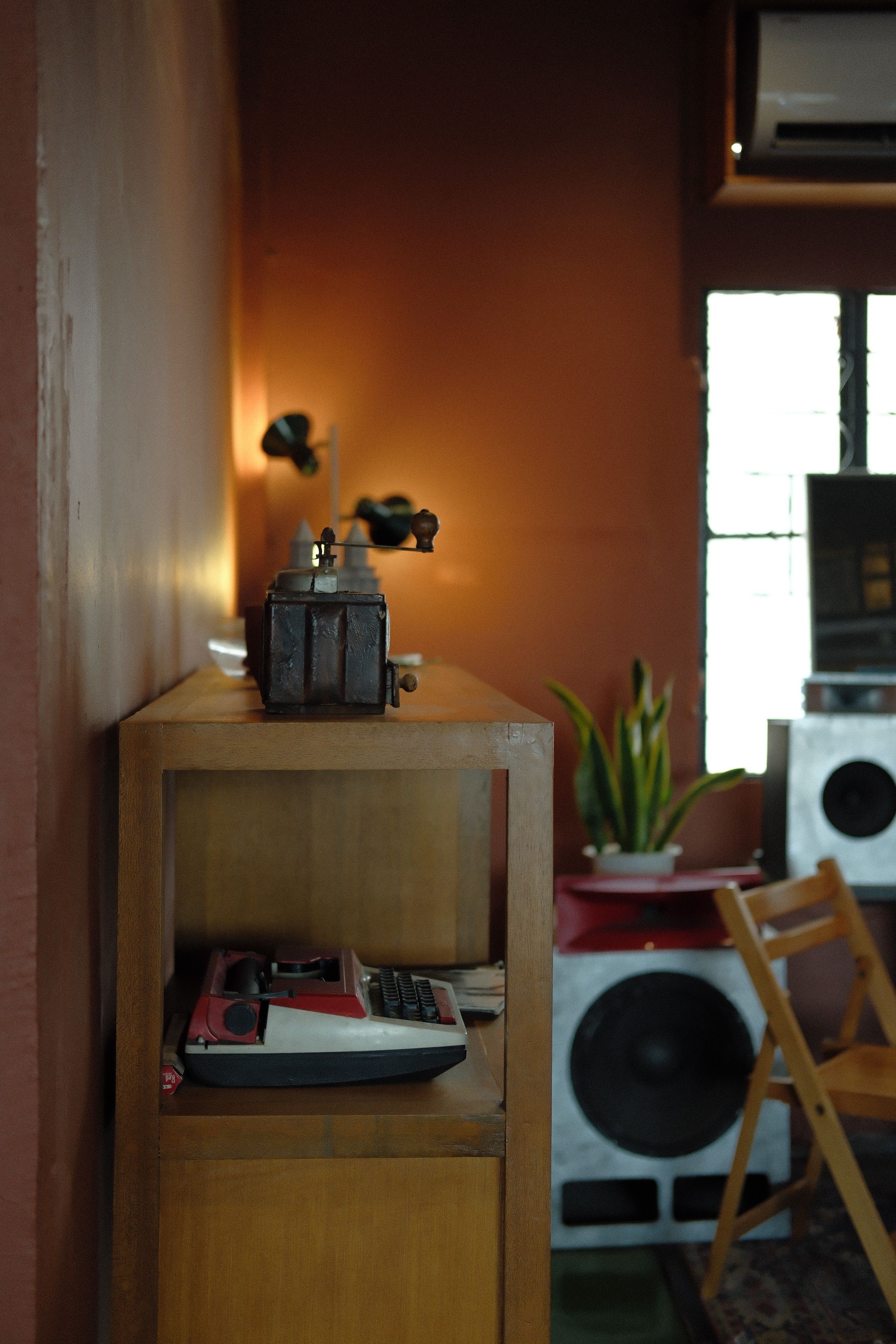 A warm, vintage-inspired living room showcasing retro decor and wooden furniture.