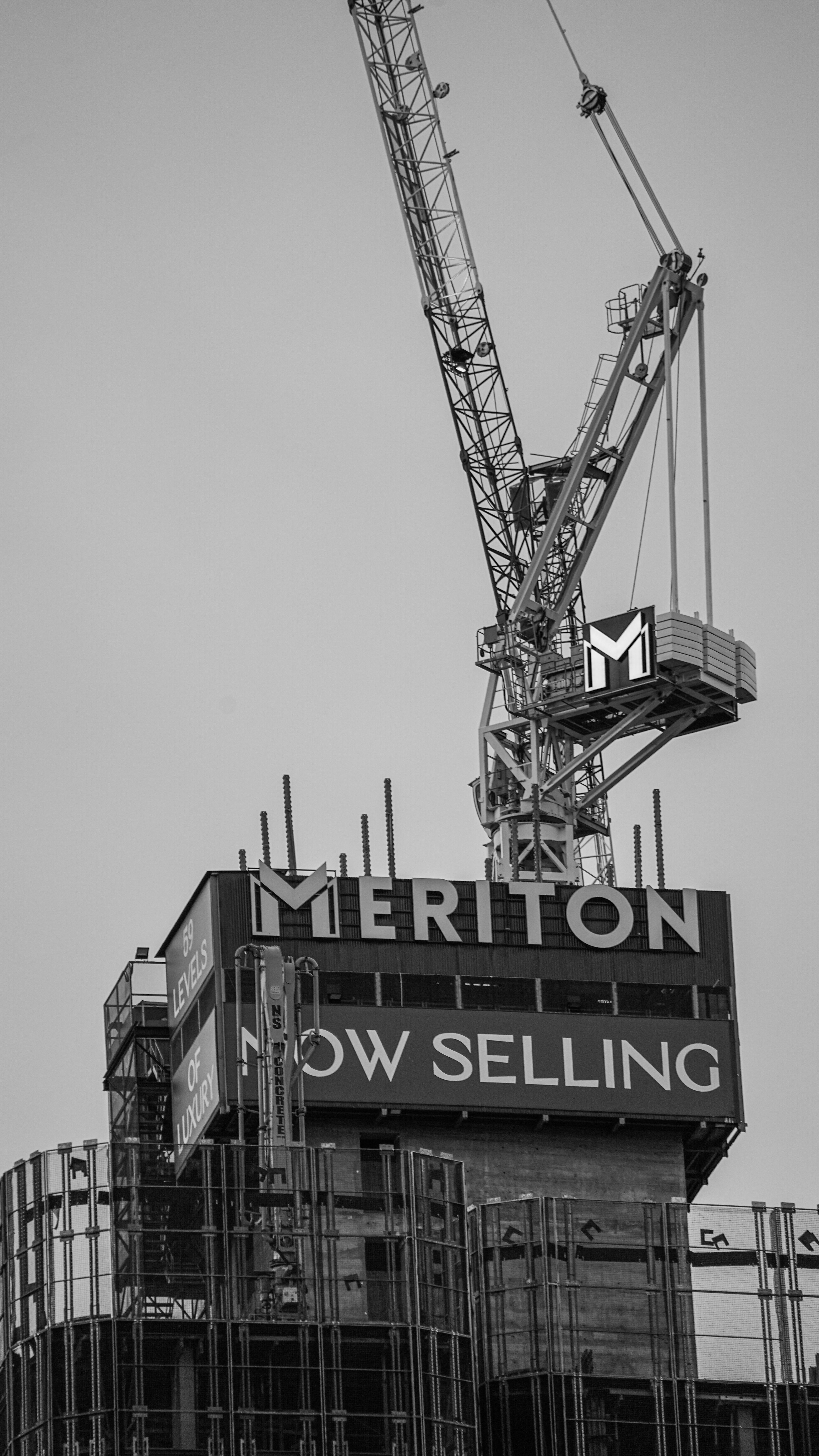 Black and White Crane Over Meriton Construction · Free Stock Photo