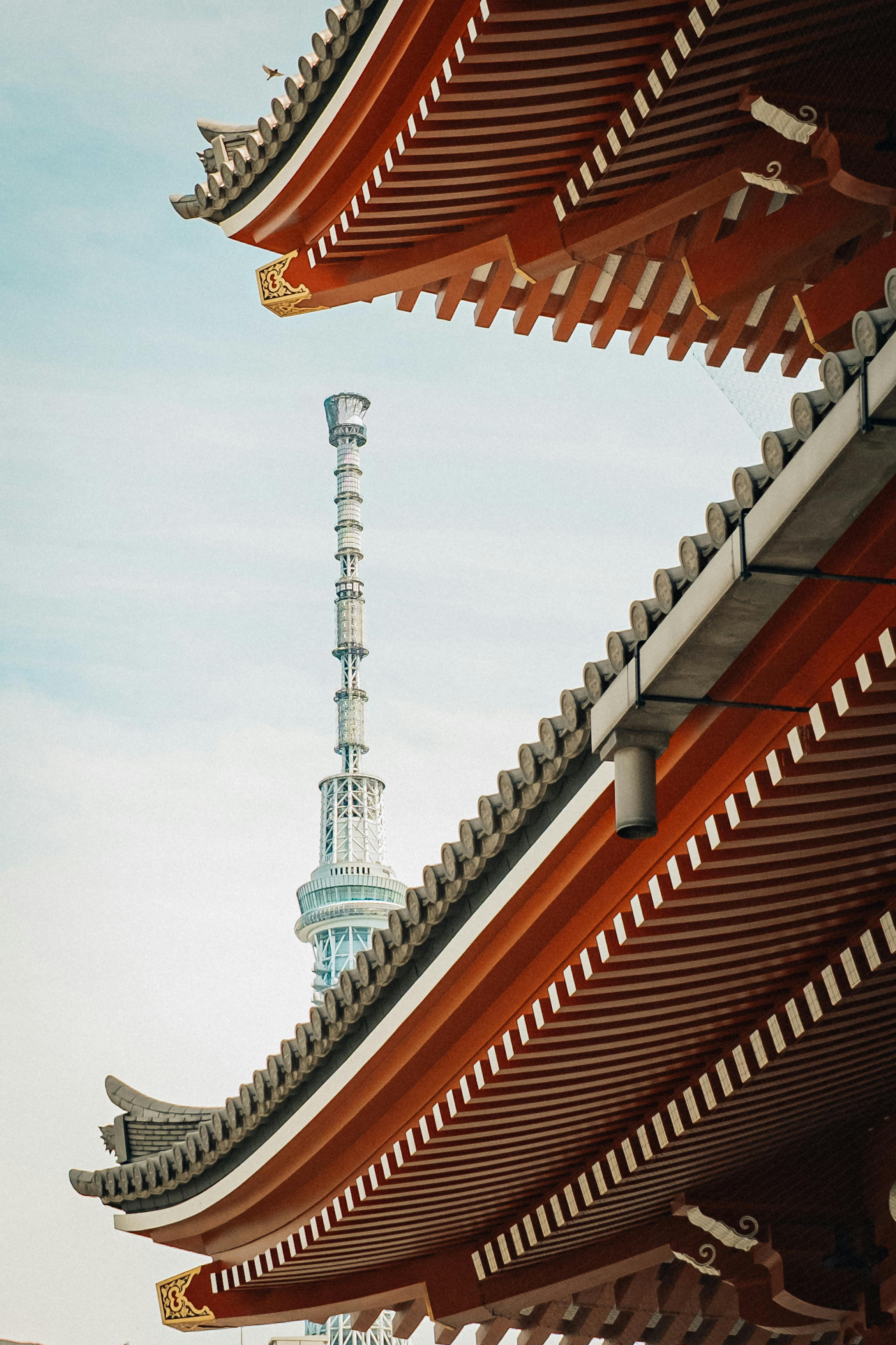 A captivating view of traditional Japanese architecture juxtaposed with the modern Tokyo Skytree.