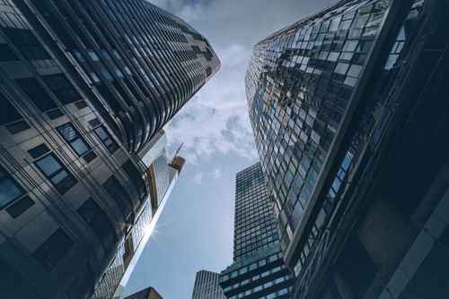 Free A dynamic view of Frankfurt's towering skyscrapers reaching into a partly cloudy sky. Stock Photo