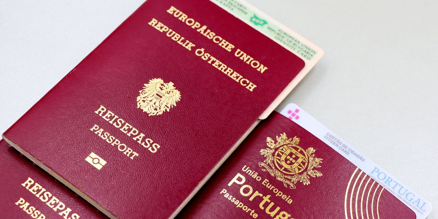 Passports and identity cards laid out on a table before a trip