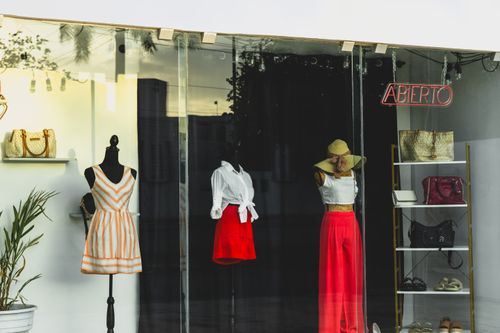 Free Fashion mannequins in a stylish boutique window display at sunset in Merida, Yucatan. Stock Photo