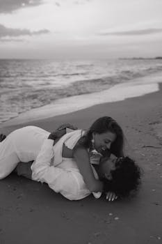 A couple in love cherishing a romantic moment on the beach during twilight.