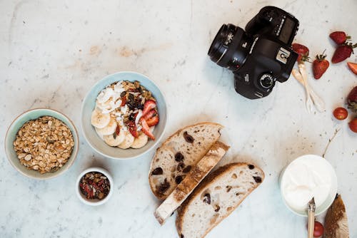 Free Black Dslr Camera on White Surface Stock Photo