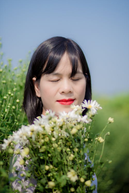 Woman Near White Flowers