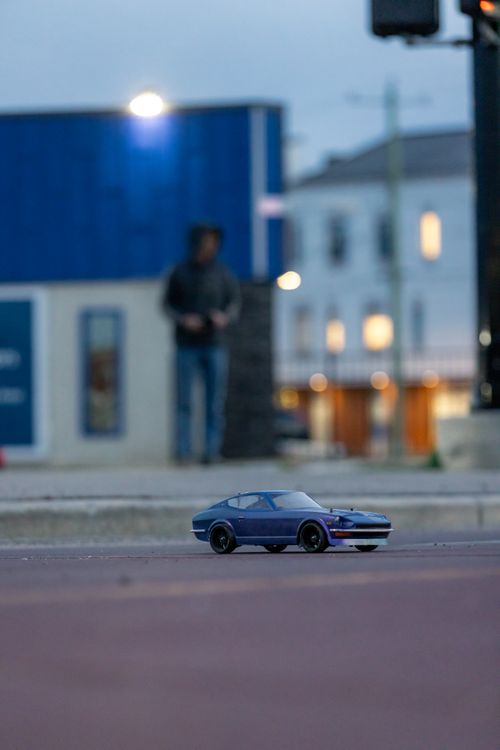 Free 280 RC Car at Dusk in Busy City Stock Photo