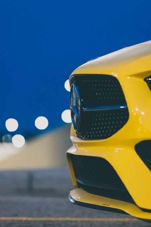 Free Bright Yellow Sports Car at Dusk Stock Photo