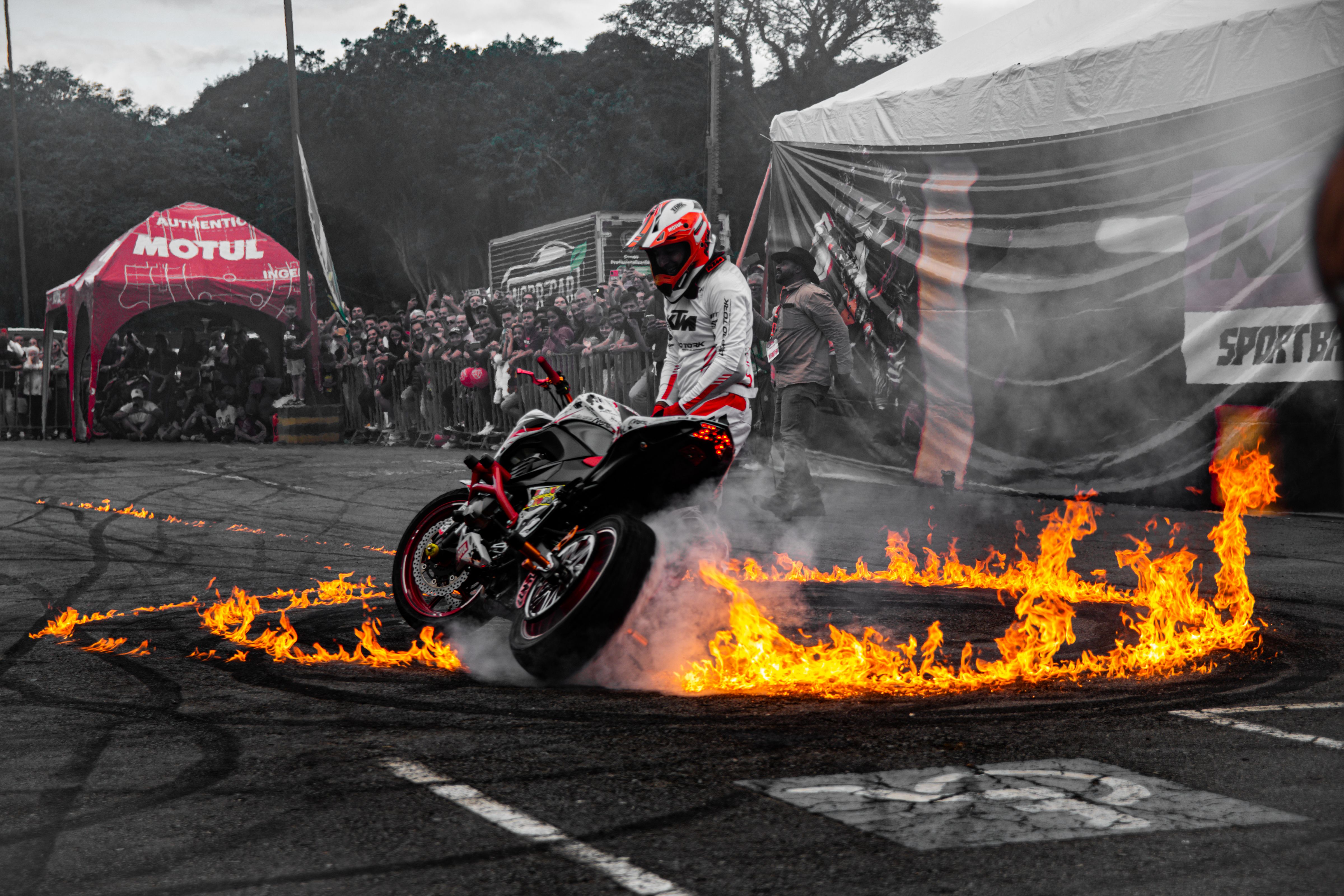 Daring Motorcycle Stunt with Fire Circle · Free Stock Photo