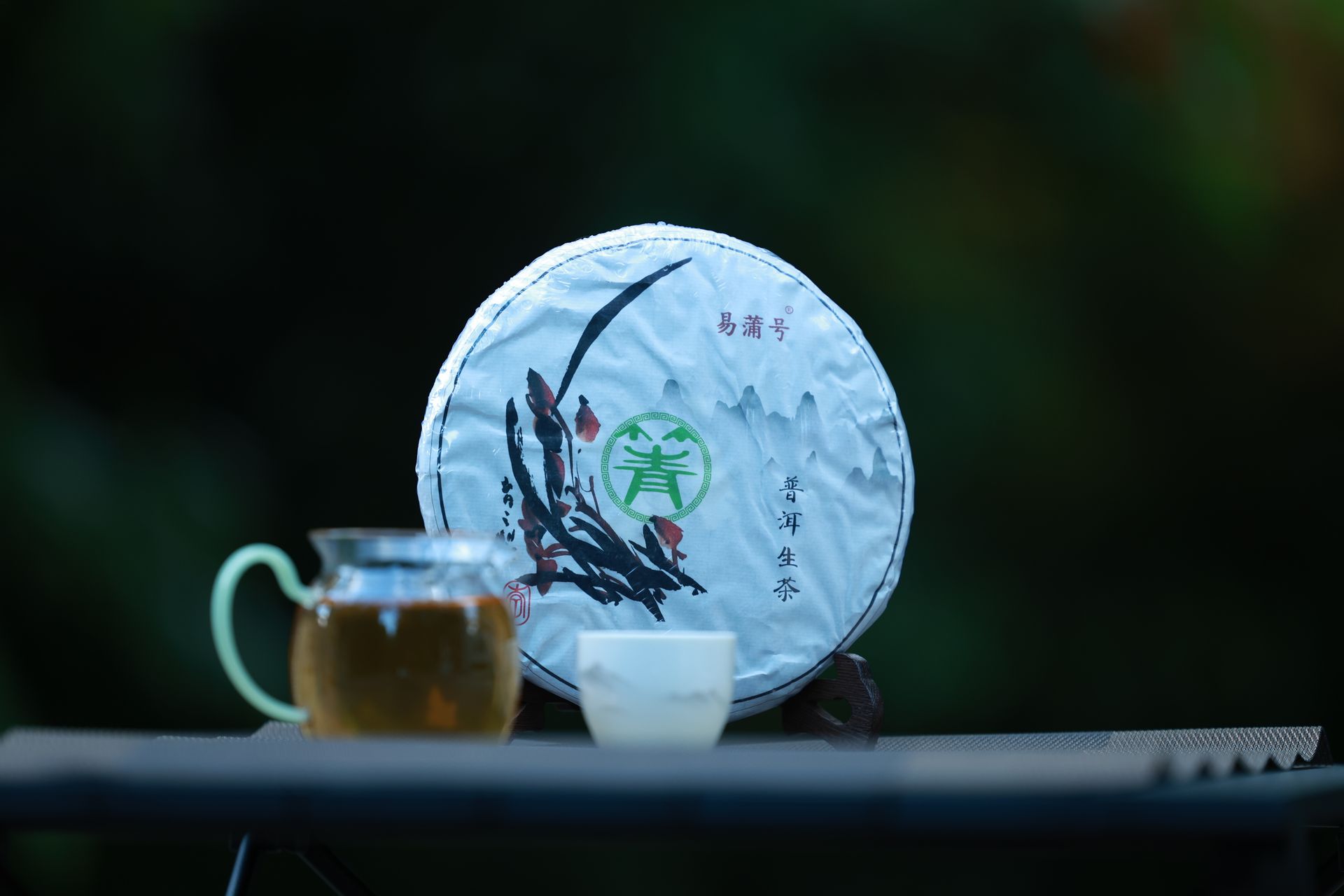 Elegant outdoor display of a traditional Chinese tea set with tea disc, capturing the essence of cultural tea brewing.