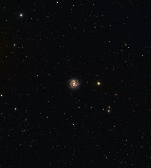 Free A breathtaking view capturing a spiral galaxy surrounded by countless stars in the night sky. Stock Photo