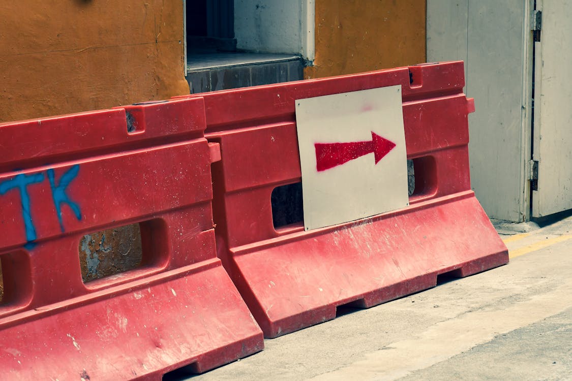 Free stock photo of arrow, building fence, construction fence