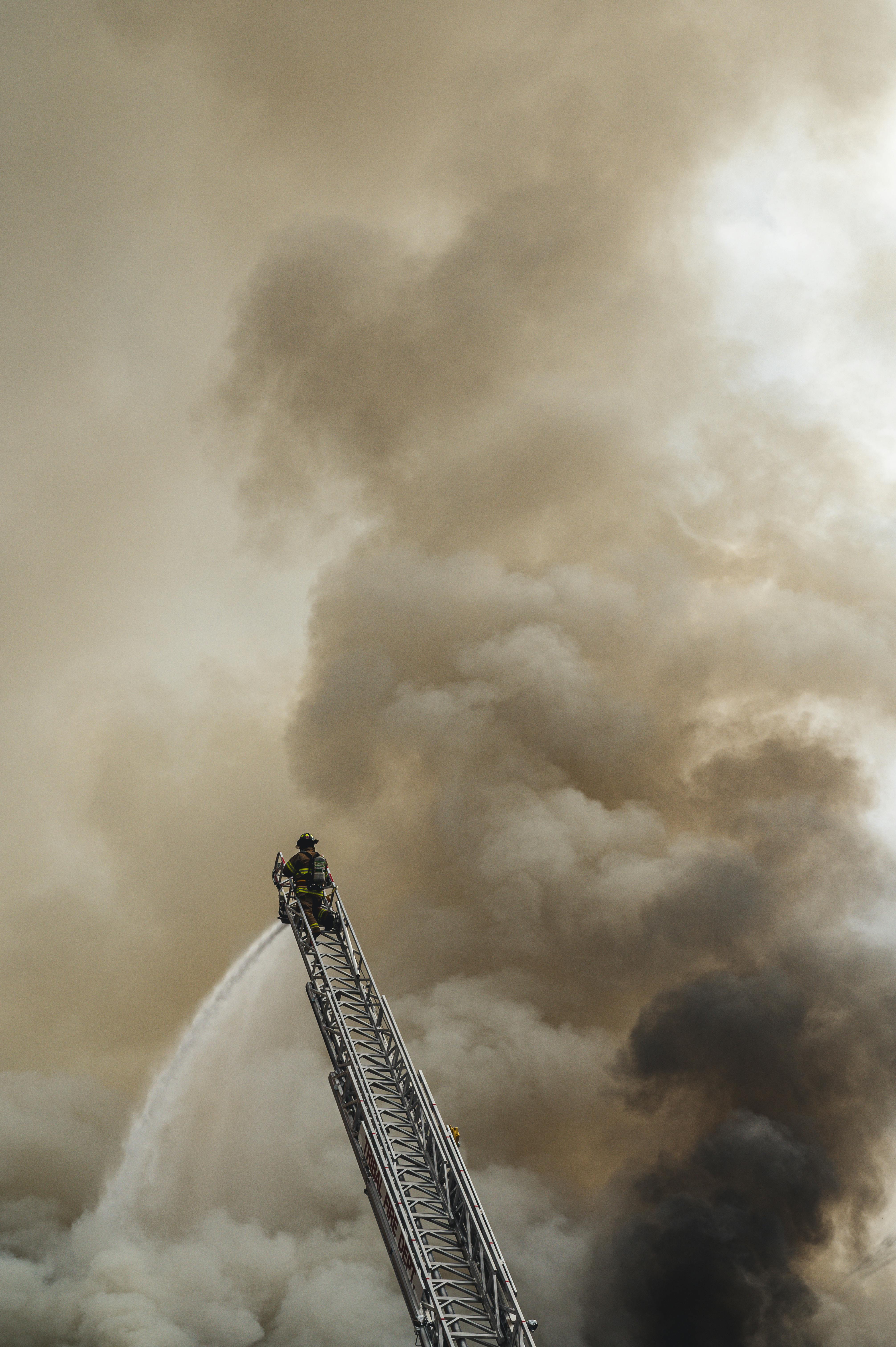 fireman on top of a ladder