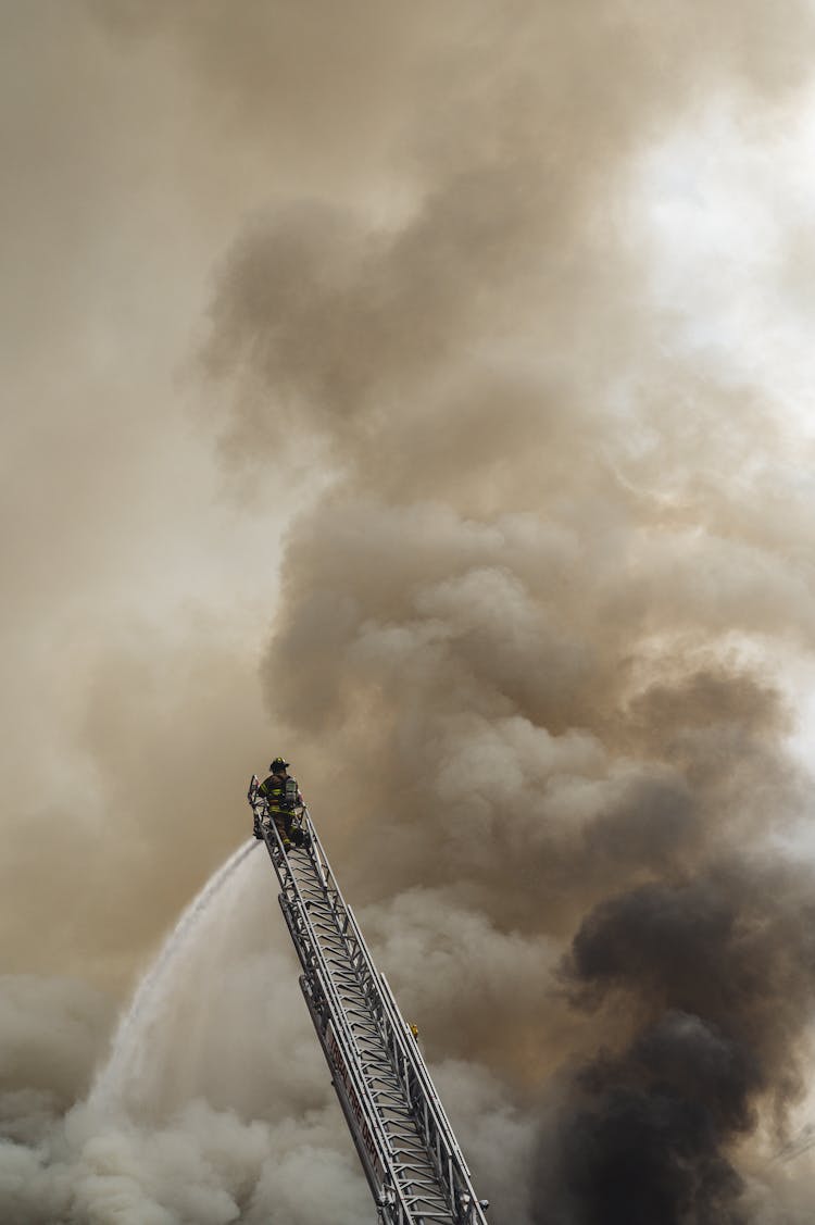 Fireman On Top Of A Ladder