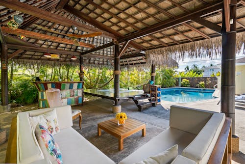 A Cozy Cabana Close To A Swimming Pool