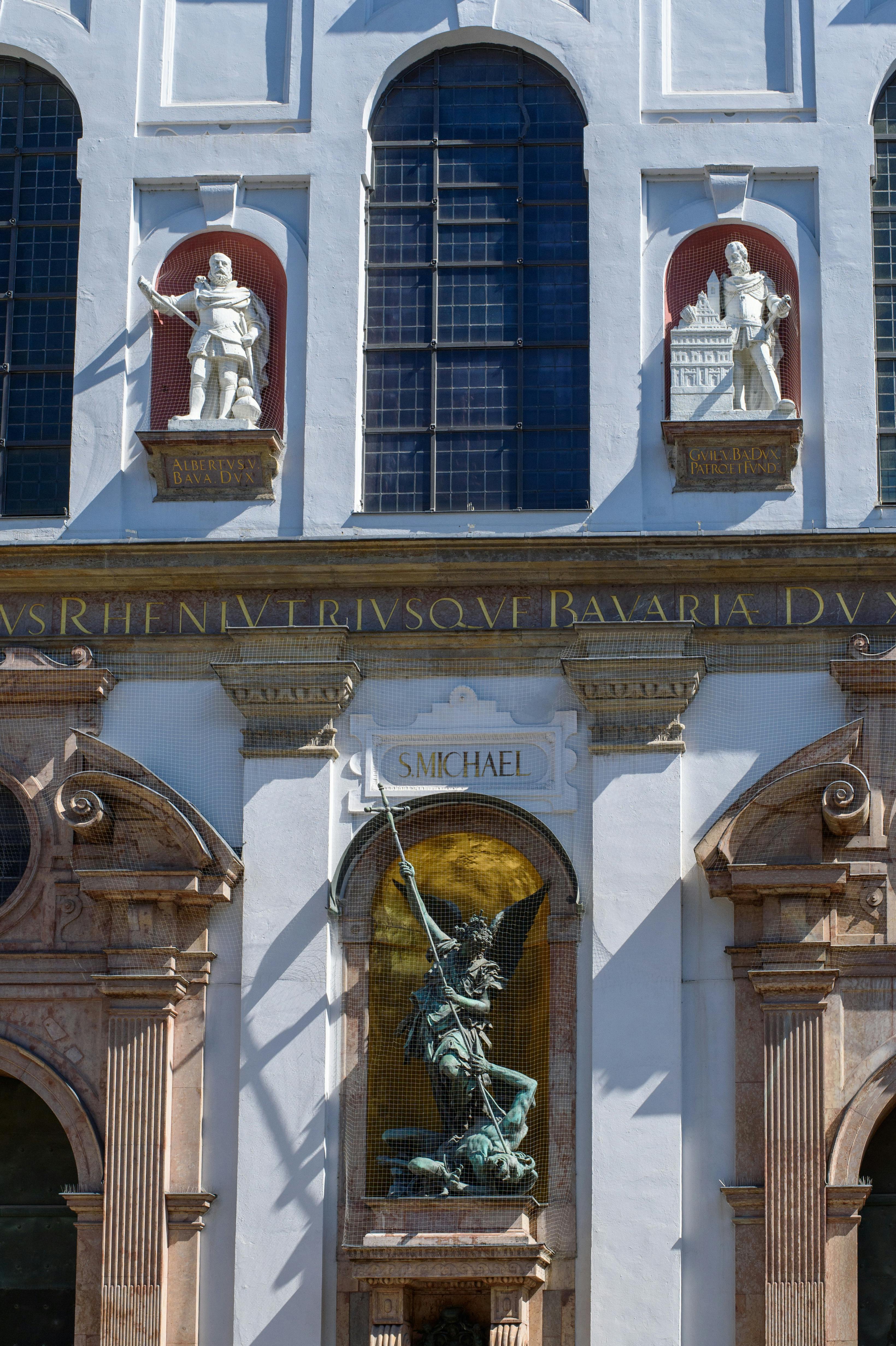 Facade of St. Michael's Church in Munich featuring detailed statues and architectural elements.