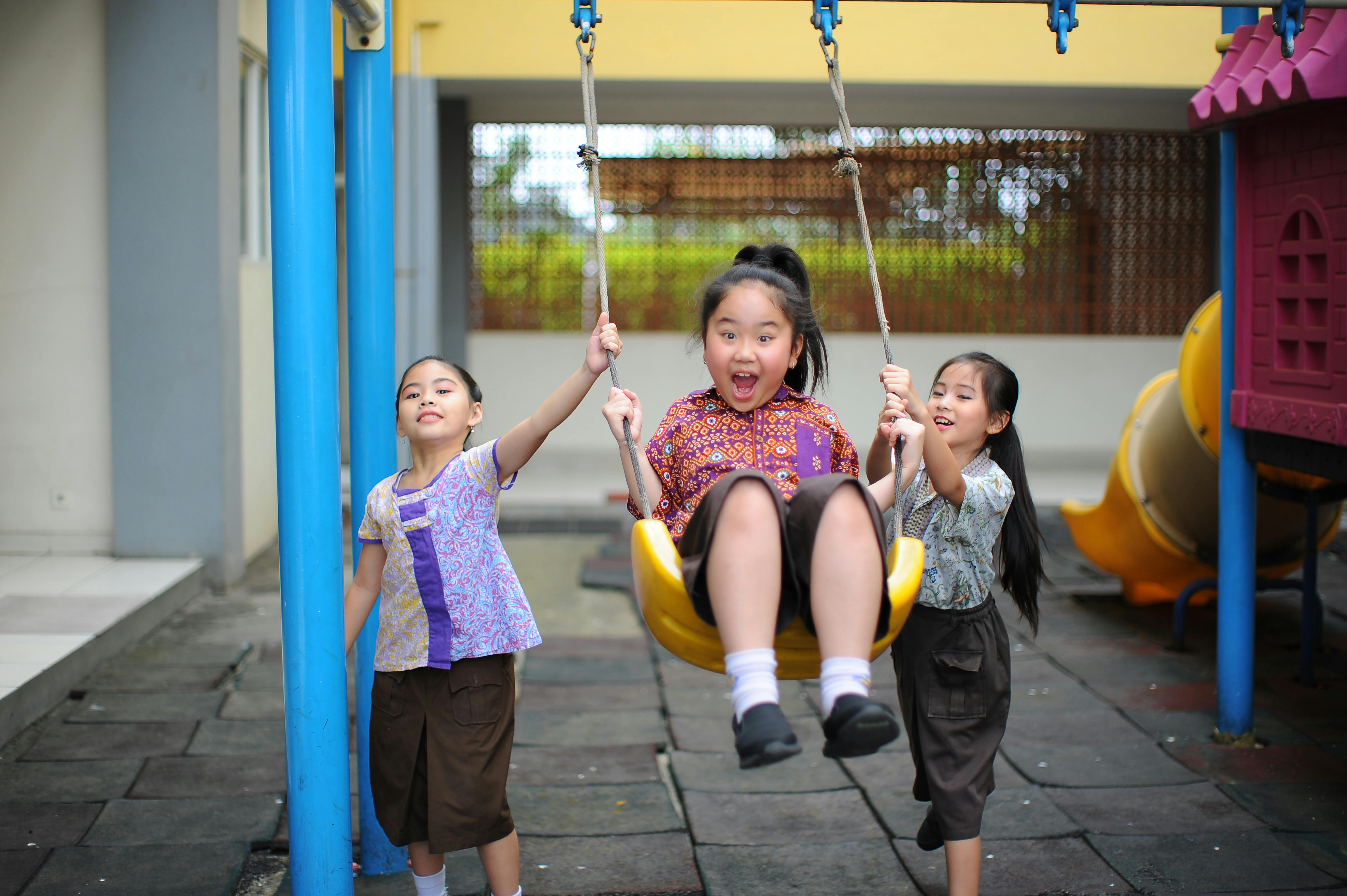 Children Practicing Kindness In Speech With Friends In A Playground Setting