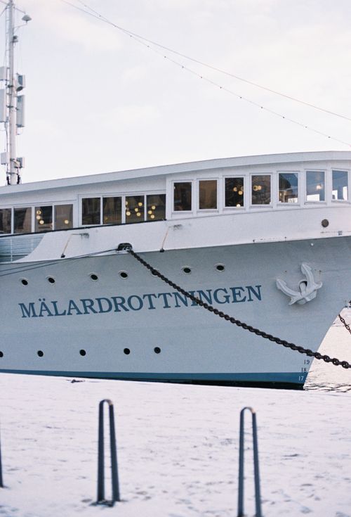 Free A stationary sight of the Mälardrottningen ship anchoring beside a snow-covered dock. Stock Photo