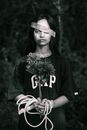 Grayscale Photo of Woman Holding Flower of Bouquet