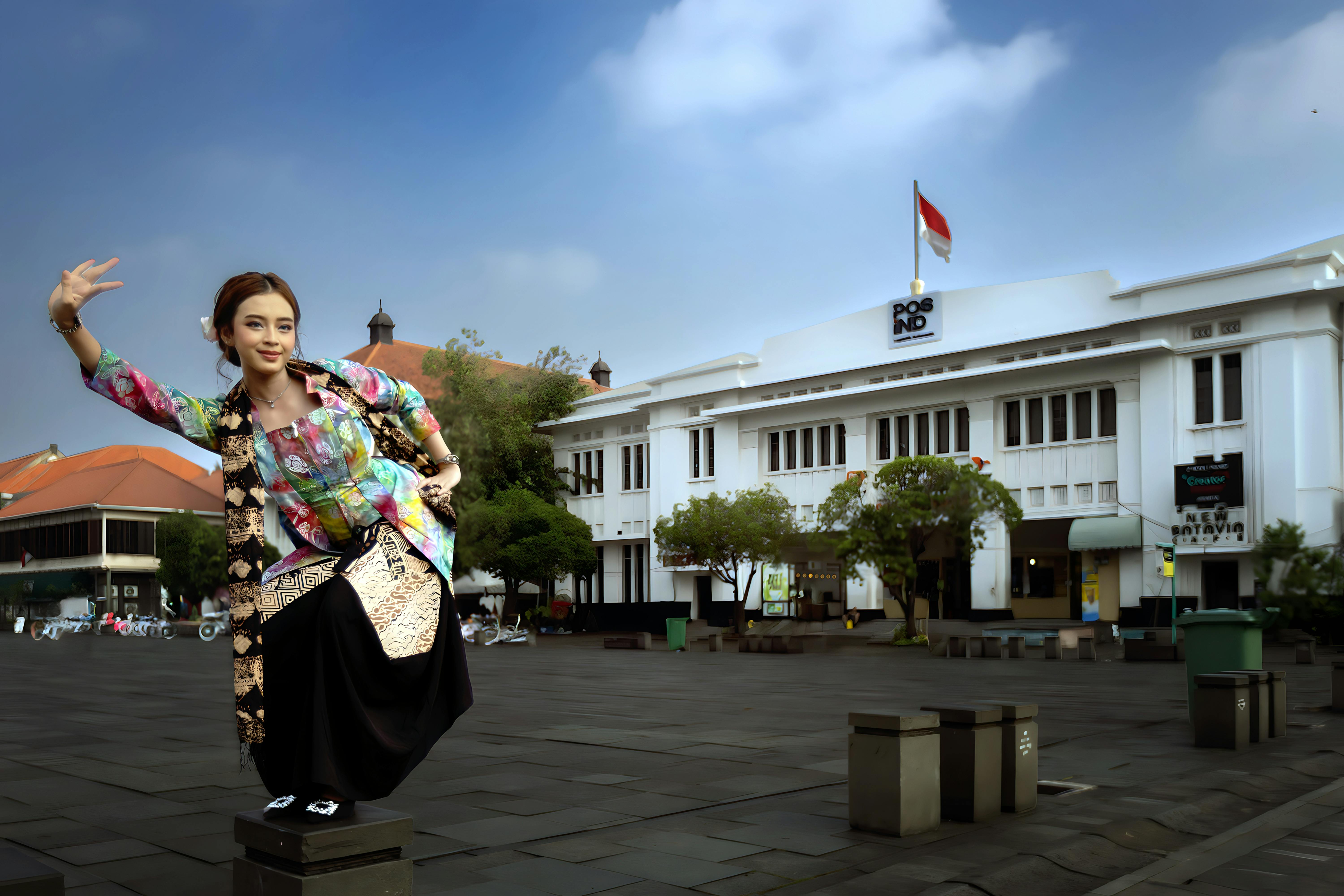 A woman performs traditional Indonesian dance in front of Museum Fatahillah, Jakarta.