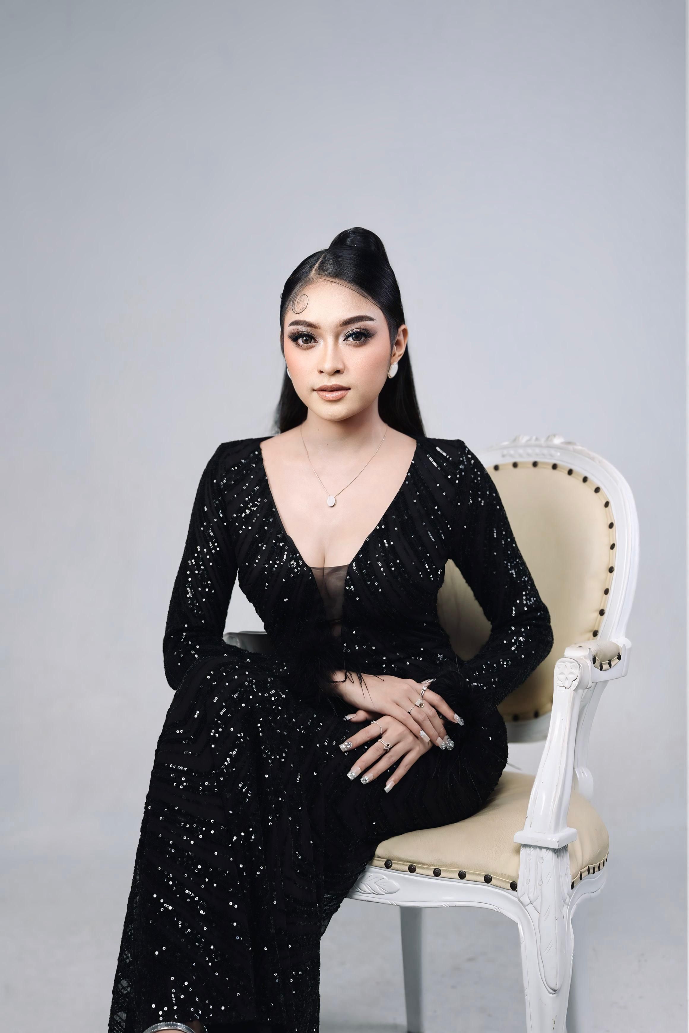 Elegant Woman in Black Dress Sitting on Chair · Free Stock Photo