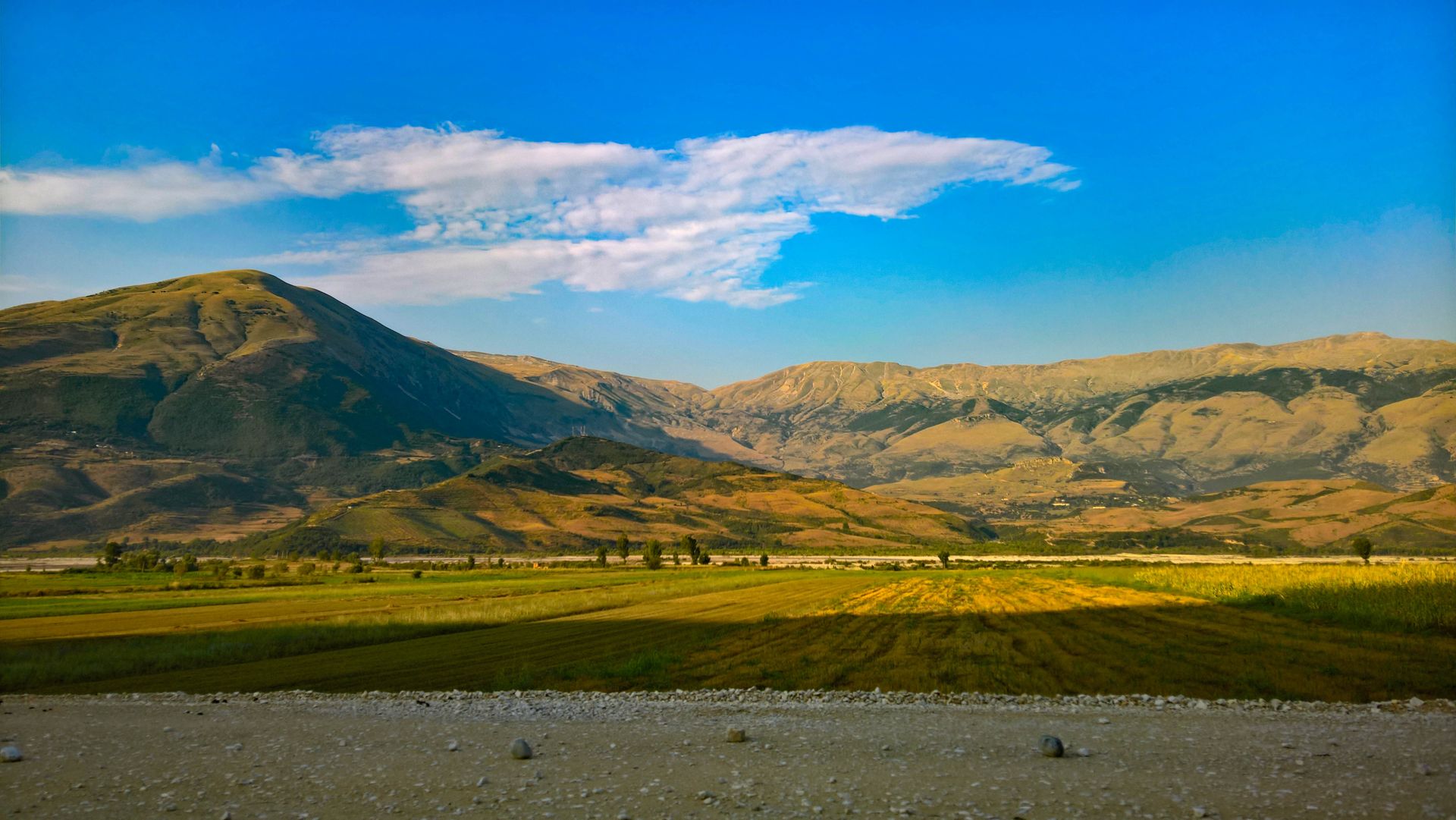 Beautiful panoramic view of the Albanian mountain landscape under a clear blue sky.