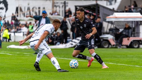 Free Two soccer players in action during an exciting match outdoors. Stock Photo