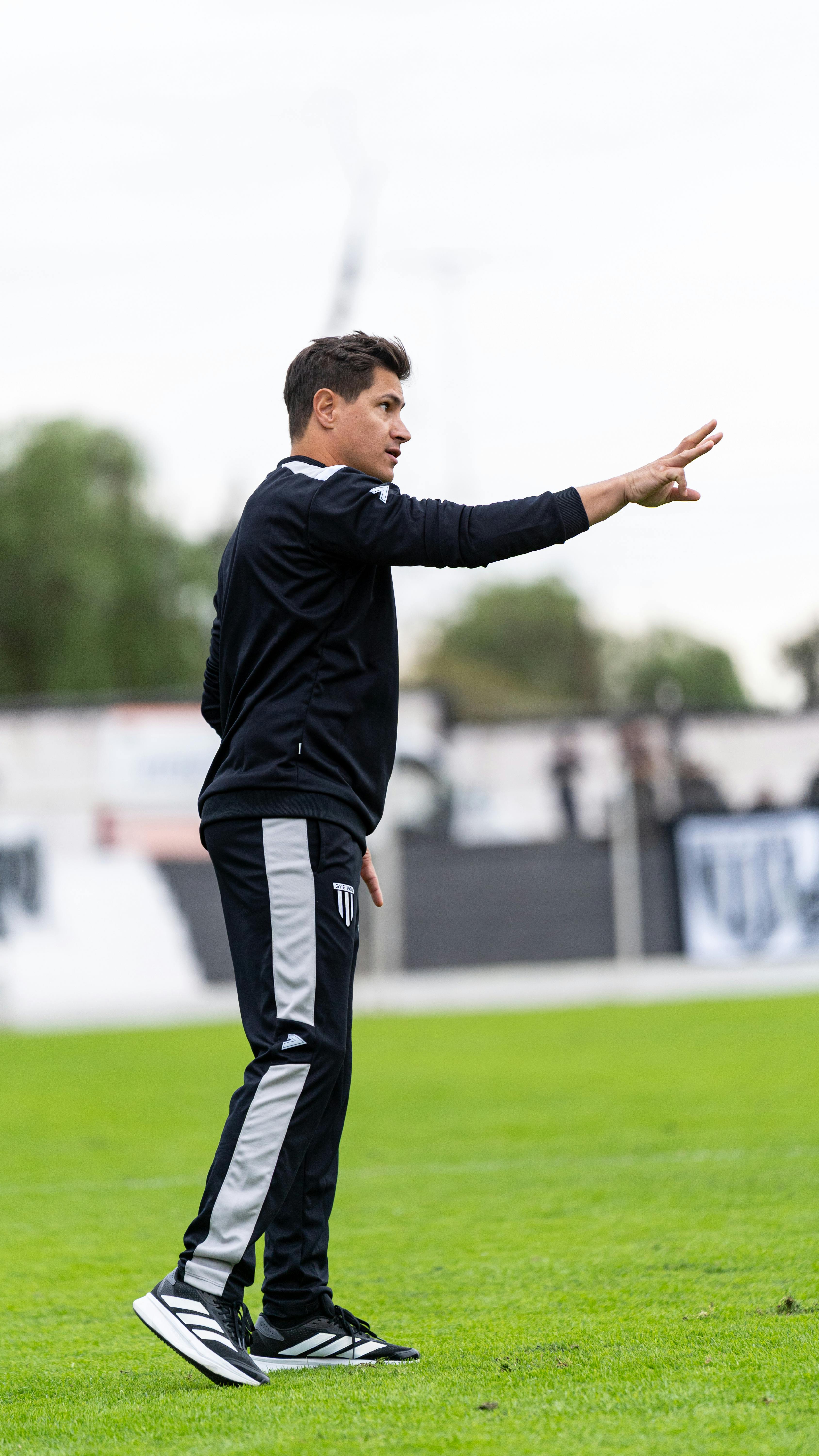 soccer coach demonstrating to the team